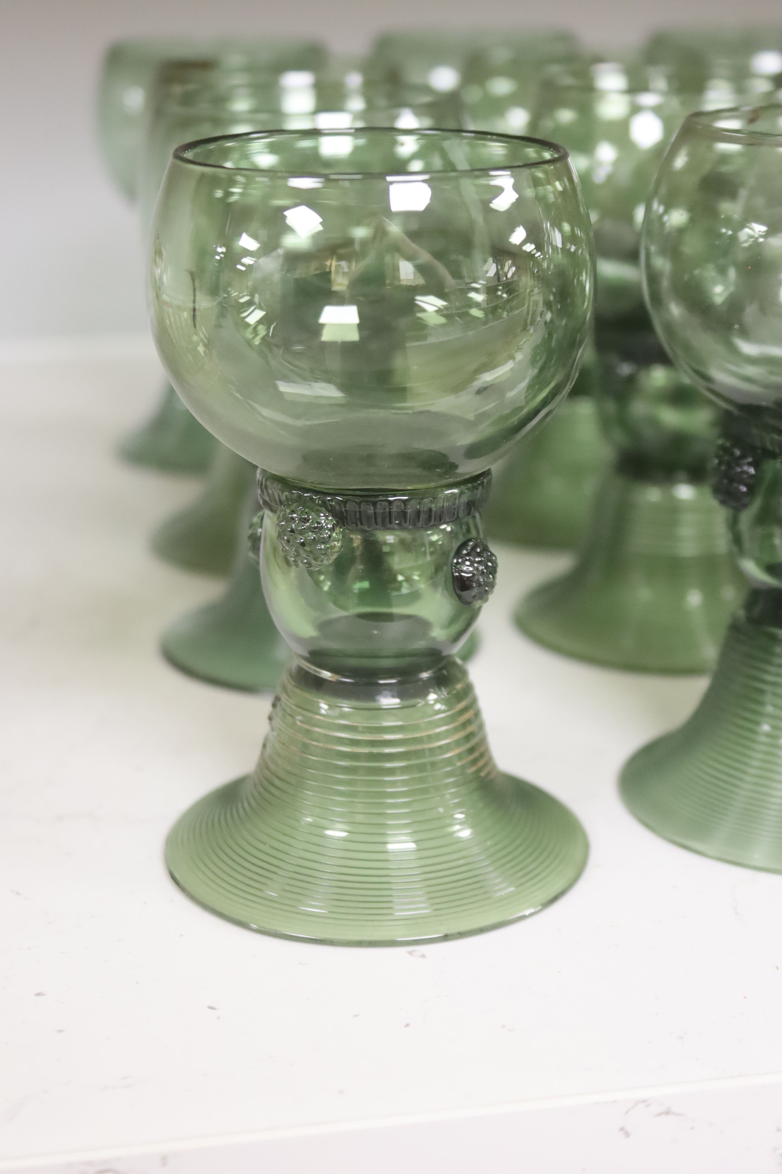 A set of thirteen Dutch green glass roemers